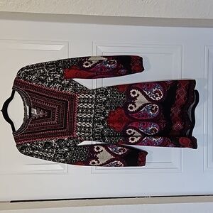 Colorful dress with beautifully stitched neckline and braided tie with bead ends